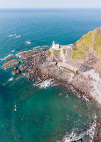 High angle view of sea shore against sky