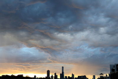 Dramatic sky over city during sunset