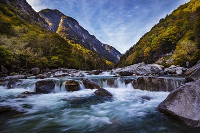 Scenic view of river flowing through rocks