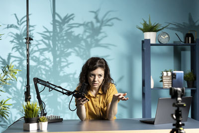 Portrait of young woman using phone