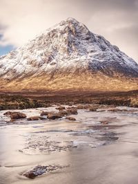 Scenic view of snowcapped mountain against sky