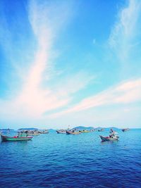 Boats in sea against sky