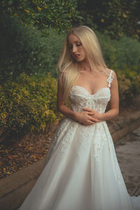 Beautiful woman standing in a garden