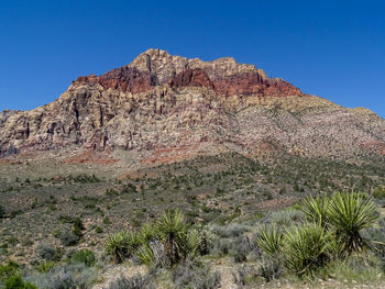 Scenic view of rocky mountains against clear sky