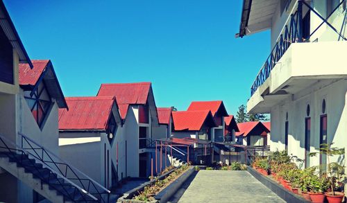 Residential buildings against blue sky