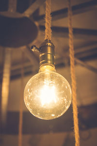 Low angle view of illuminated light bulb