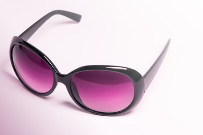 Close-up of sunglasses against white background