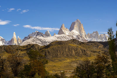 Scenic view of mountains against clear blue sky