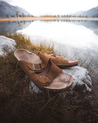 High angle view of shoes on lakeshore