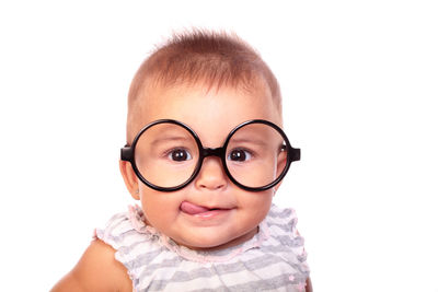 Portrait of smiling boy against white background