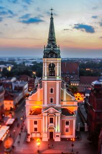 Illuminated cityscape at sunset