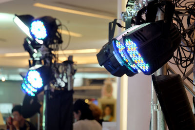 Low angle view of illuminated lighting equipment