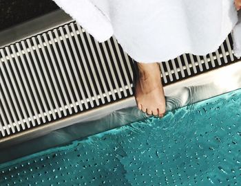 Low section of woman in water