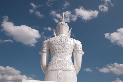 Low angle view of statue against sky