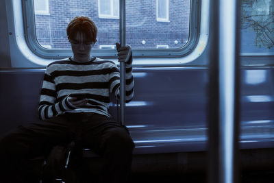 Man sitting in train