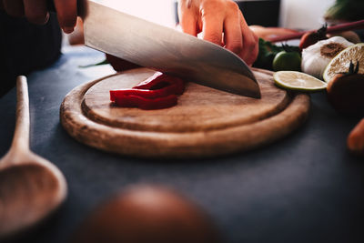 Close-up of man preparing food on table