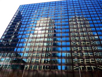 Low angle view of office building against sky