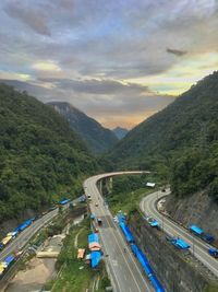 High angle view of road amidst mountains against sky