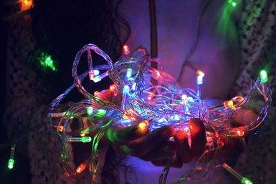 Close-up of illuminated christmas tree at night