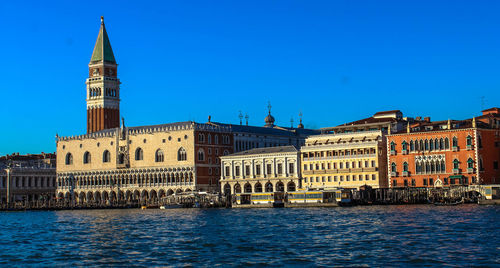 Buildings against blue sky and clouds