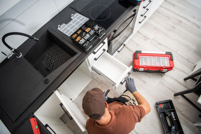 High angle view of boy working on table