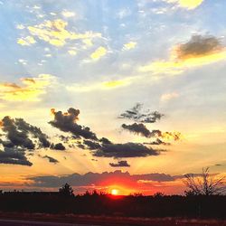 Scenic view of landscape at sunset