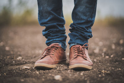 Low section of person wearing shoes