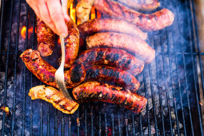 Close-up of meat on barbecue grill