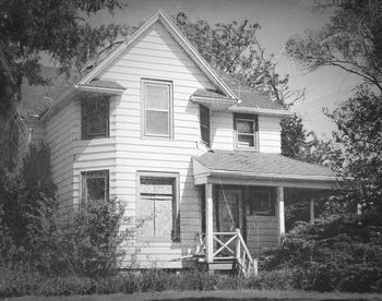 House with trees in background