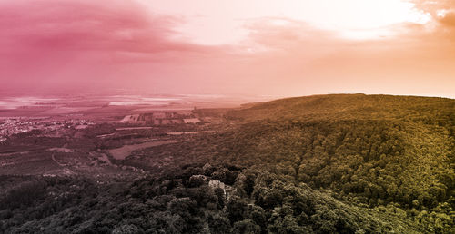 Scenic view of landscape against sky during sunset