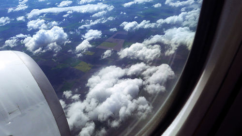 Aerial view of clouds seen from airplane window