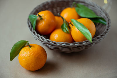 High angle view of fruits in basket on table