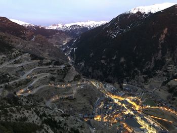 Aerial view of snowcapped mountains against sky