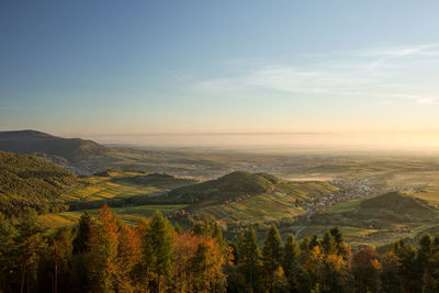 Scenic view of landscape against sky during sunset