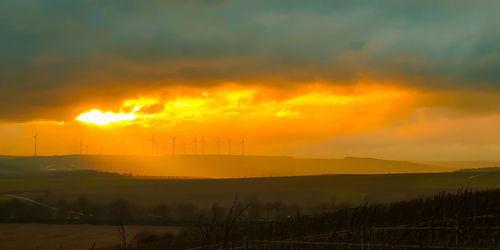 Scenic view of dramatic sky during sunset