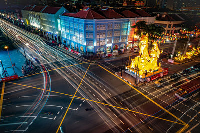 High angle view of light trails on road at night