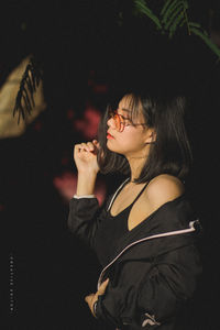 Portrait of young woman smoking