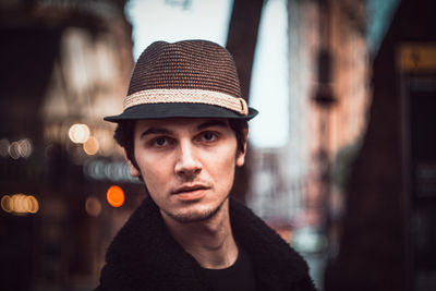 Close-up portrait of man in city