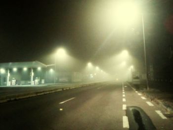 View of illuminated street at night