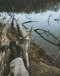 Close-up of hand in lake