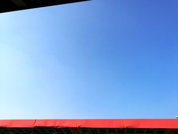 Low angle view of built structure against clear blue sky