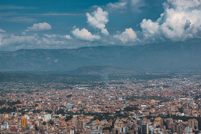 Aerial view of townscape against sky