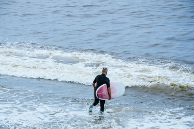 Rear view of man on beach