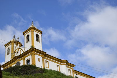 Low angle view of building against blue sky