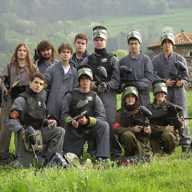 togetherness, lifestyles, leisure activity, casual clothing, bonding, grass, men, friendship, person, sitting, young men, love, smiling, field, young adult, happiness, large group of people, front view