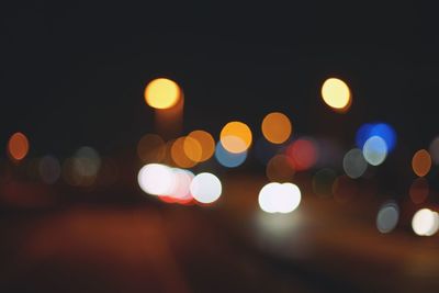 Defocused image of illuminated lights at night