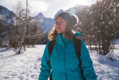 Full length of woman on snow covered field