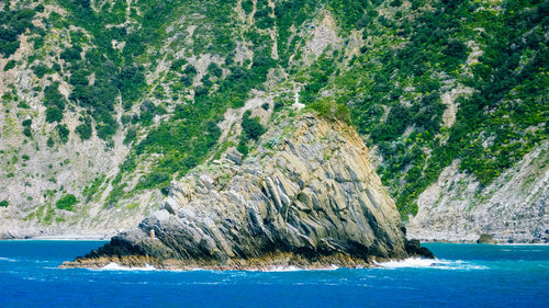 Scenic view of sea by rocks