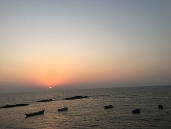 Scenic view of sea against clear sky during sunset