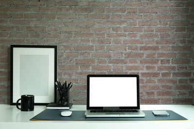 Low angle view of electric lamp on wall